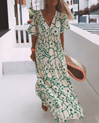 Sara | Losse Jurk met V-hals en Print