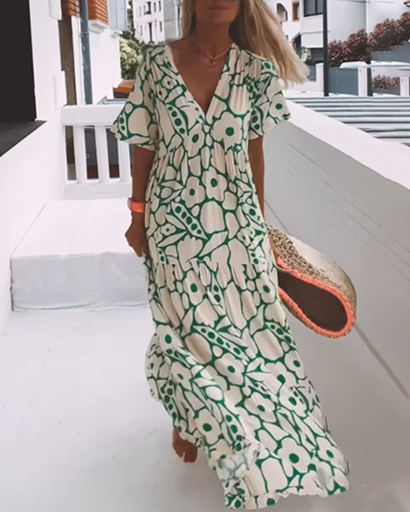 Sara | Losse Jurk met V-hals en Print
