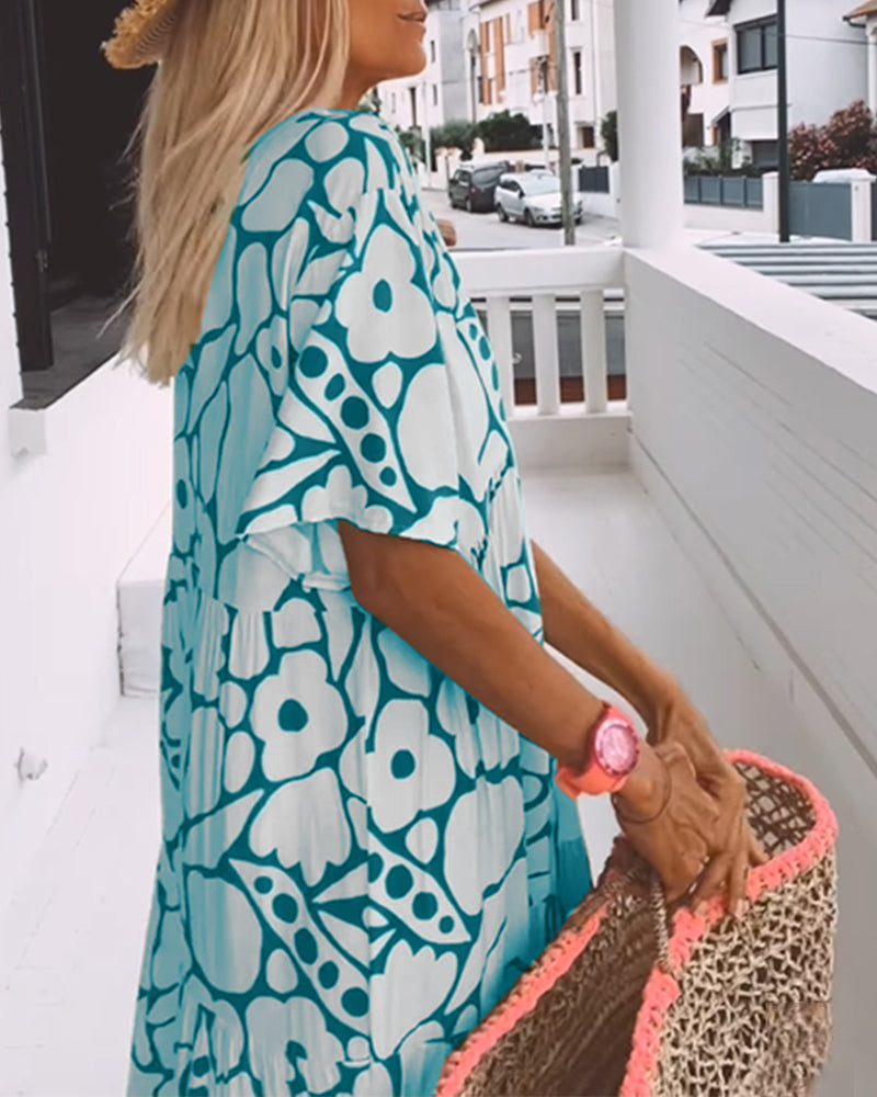 Sara | Losse Jurk met V-hals en Print