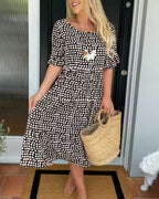 Noor | Midi-jurk met ronde hals en stippenprint