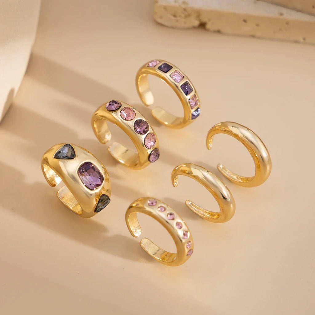 Set van 6 Goudkleurige Ringen met Paarse Zirkoon – Verstelbaar & Luxe Afwerking
