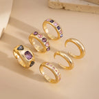 Set van 6 Goudkleurige Ringen met Paarse Zirkoon – Verstelbaar & Luxe Afwerking