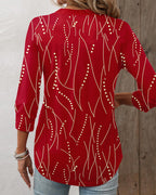 Elegante top met drukknopen en V-halslijn